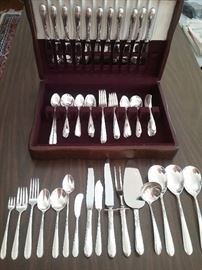 "Heiress" by Oneida...102 pieces total....24 tea spoons...12 dinner forks..12 salad forks...12 dinner knives...12 individual butter knives..13 soup spoons...8 ice tea spoons...3 large serving spoons...1 gravy spoon...1 meat knife..1 meat fork...1 large butter knife...1 condiment fork...1 cake knife/server