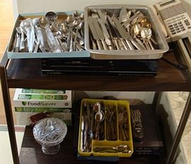 Several silverware sets