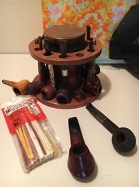 Pipe stand and also about a dozen smoking pipes
