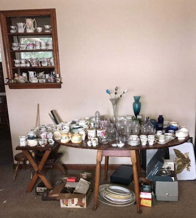 Beautiful dining room table. All vintage tea cups and plates, salt and pepper shakers etc