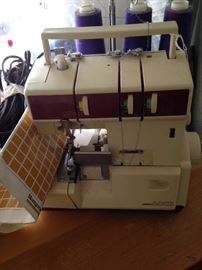 HappyLock serger; threads, sewing notions, and material - also available