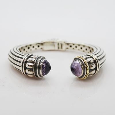 Lagos Caviar Sterling Silver 18K Gold Amethyst Cuff Bracelet: A Lagos Caviar sterling silver 18K yellow gold amethyst cuff bracelet. This cuff features Amethyst cabochon melon stations, with a tapered reeded bracelet shape and center hinge.