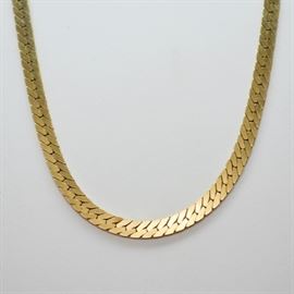 14K Yellow Gold Herringbone Necklace: A 14K yellow gold herringbone chain necklace. It is princess length.
