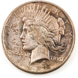 Key Date 1921 High Relief Peace Dollar: A key date 1921 high relief Peace dollar. Designer: Anthony de Francisci. Mintage: 1,006,473. Metal Content: 90% silver 10% copper. Diameter: 38.10 mm. Weight: approximately 26.73 grams. Circulated. Fair condition.
