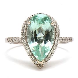 14K White Gold 4.14 Carats Tourmaline Diamond Statement Ring: A 14K white gold cocktail ring featuring a tourmaline with a halo of diamonds.