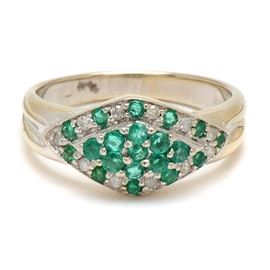 14K White Gold Natural Emerald and Diamond Ring: A 14K white gold ring featuring a diamond-shaped crown adorned with natural emeralds and diamonds.