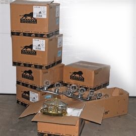 Lighting Assortment: A variety of light fixtures in silver and gold tones all in original packaging.