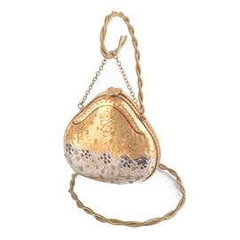 Limoges Trinket Box With Wire Display: A Limoges trinket box with a wire display. This hand-painted trinket box has a gold and silver-toned body with a hammered finish, gold-toned chain and clasp closure with a metal wire for display. The piece is marked to underside “L.T. Peint Main, Limoges France".