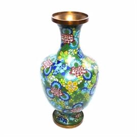 Chinese Cloisonne Vase: A Chinese cloisonne vase. This piece features a central floral design in a vibrant palette of green, blue and crimson. This vase is not marked.