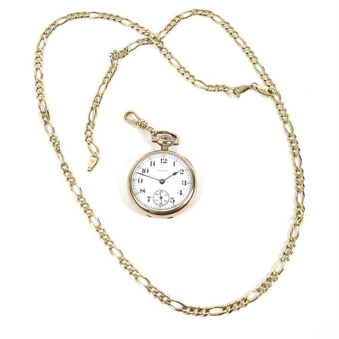Elgin 10K Yellow Gold Pocket Watch and 14K Gold Filled Chain: An Elgin 10K yellow gold pocket watch and 14K yellow gold filled Figaro chain.