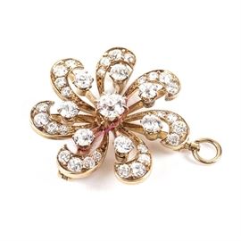 Victorian Pinwheel 14K Yellow Gold Brooch Pendant with Diamonds: A Victorian pinwheel 14K yellow gold brooch pendant with diamonds.