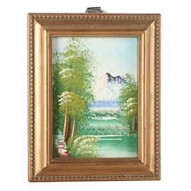 Miniature Oil Painting on Board of a River Landscape: A miniature oil painting on board. The diminutive landscape depicts a wood bordered river that flows down to the foreground, as a mountain rises in the distance. This work is unsigned and presented in a gold tone wooden frame with a triangular hanger attached on verso.