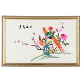 Chinese Bird-and-Flower Embroidery: A Chinese embroidery on silk in the bird-and-flower style. This piece features two colorful, pheasant-like birds perched with peonies and cherry blossoms growing behind them. There are East Asian characters to the top left. The piece is presented behind glass in a wood frame that is wired for hanging.