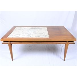 Mid Century Modern John Widdicomb Coffee Table With Marble Inlay: A John Widdicomb Mid Century Modern coffee table with marble inlay. This maple coffee table features a rectangular table top with a square shaped white marble inlay. The table top is supported by four tapered legs. The bottom of the table is marked, “Made By John Widdicomb.”
