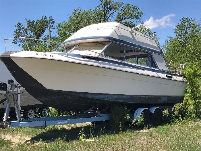 1977 Bayliner Victoria.  Twin Volvo Penta four-cylinder motors.  Cabin cruiser sleeps six; full kitchen.  Mechanicals have been well maintained.  Professionally winterized last fall and had oil and filter change.  Trailer has 4 brand new tires, new wiring, new lights - ready to roll!  Must make appt to see!  (off property)