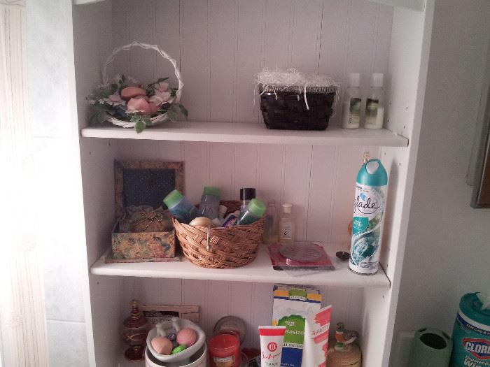 Bathroom Rack Shelf and assorted lotions creams, scent bottles