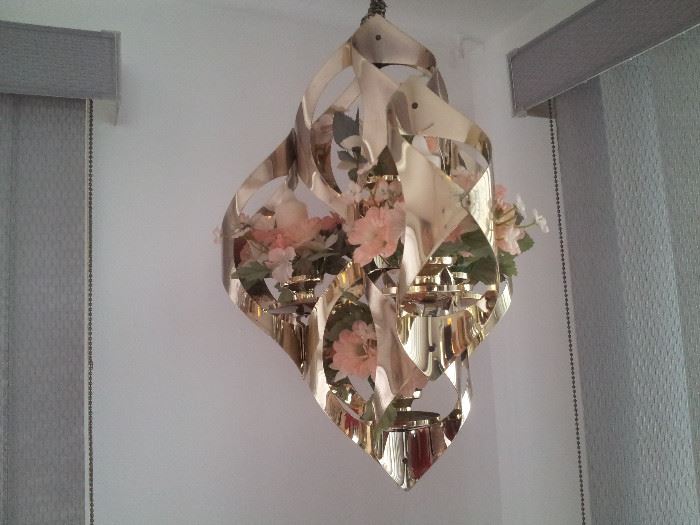 Very nice Polished Brass Candle & Flower Light.  No electricity needed.  Hanging Chain included. Also can remove candles and flowers (included) and replace with LED ot tea lites