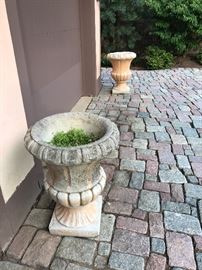Six (6) large concrete urns available