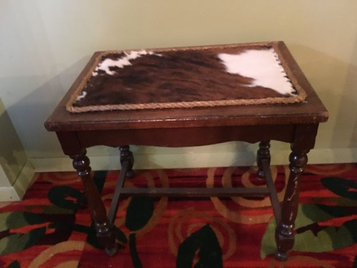 Antique table with cowhide insert