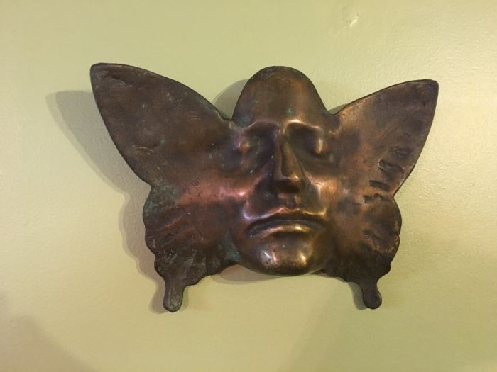 Bronze butterfly with man's face art