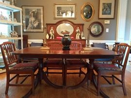 Pristine 1940's mahogany dining table, with three leaves and six side chairs, by Drexel.