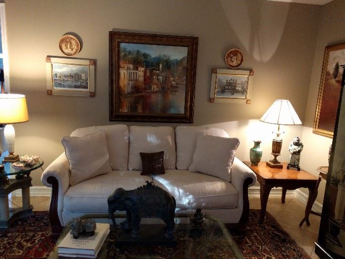 Very comfy couch, cool Italian artwork, inlaid wooden side table, Asian cloisonné vase and porcelain figure. Check out the elephant on the coffee table - it's special!