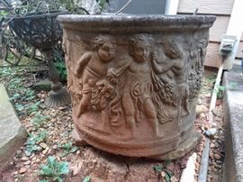 There's a pair of these frolicking putti concrete planters. Putti can frolick, don't judge.