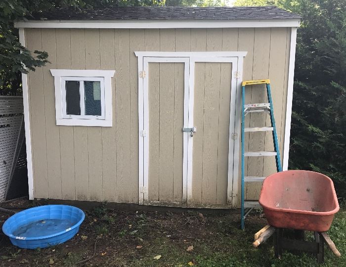 This shed isn't for sale, but the tools and garden items inside are for sale. The shed in the previous photo is for sale.