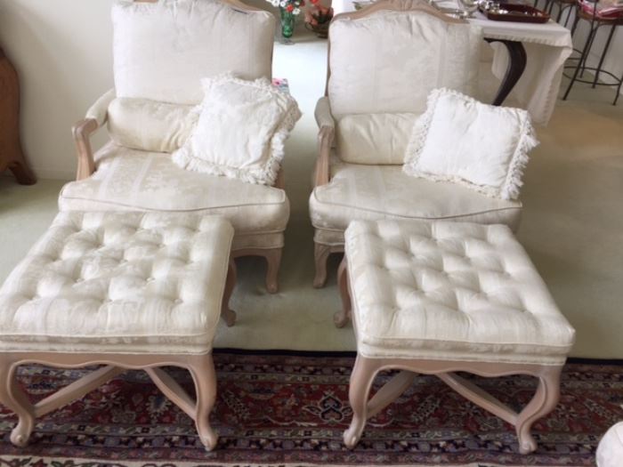 Pair of French Provincial chairs with ottomans