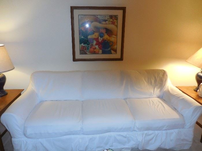 White Slipcover  and underneath is Cream Sofa. Sofa purchased from Crate Barrel 