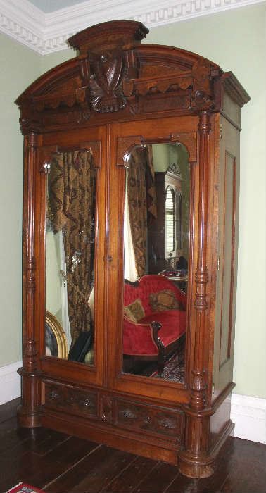 37 - Oversize walnut Victorian wardrobe, ornately carved with column front, burl trim and original glass from Adams French Mansion, Aberdeen, MS, 9 ft 7 in. T, 5 ft. 1 in. W, 27 in. D.