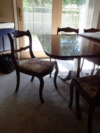 DROP LEAF TABLE WITH LEAVES AND 7 ROSE CARVED CHAIRS