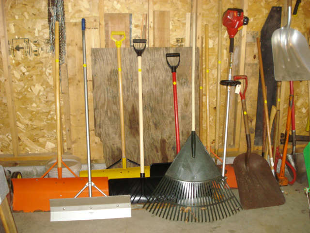 plastic and metal snow shovels, rakes