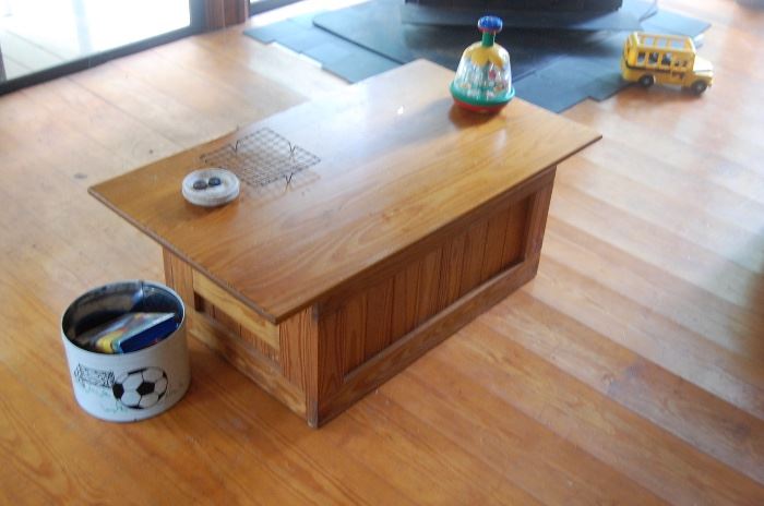Coffee Table Lifts up to eat off of it. 