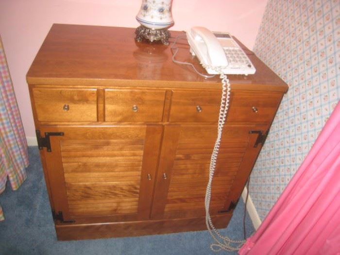 One of 2 bedside tables with storage