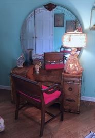 VANITY WITH CARVED DETAILING, ALL DOOR AND DRAWER PULLS IN TACK, ORIGINAL MIRROR AND ETCHED VANITY GLASS.