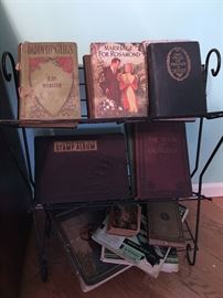 ANTIQUE BOOKS AND WROUGHT IRON BOOK RACK