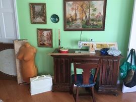 SINGER SEWING MACHINE WITH ATTACHMENTS AND DELUXE CABINET, WORKS GREAT! DRESS FORM, CUTTING BOARD AND OTHER ACCESSORIES