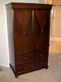Gorgeous solid wood TV armoire with drawers. Doors open and lay flat against sides.