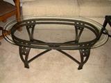 Metal base coffee table with beveled glass top.