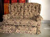 Adorable loveseat sized double recliner. Upholstered in a floral tapestry. Comes with arm covers.