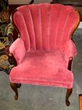 Set of two rose colored, velvet upholstered wing back chairs.