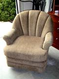 Upholstered, rocker glider armchair.