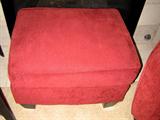 Red upholstered ottoman...has matching sofa.