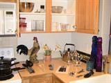 Various kitchen items...Rooster! Glass decorative bottles. Tea kettle...tea serving set.