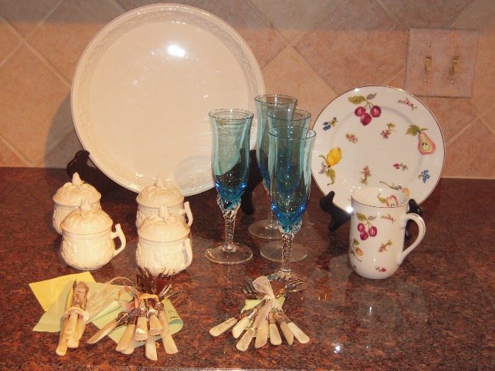 White Mottahedeh Pot De Creme set has 8 pots and the serving plate.  George Briard service for 6 dessert plates and cups.  Two sizes of forks with pearl handles and one size of knives made in England.  Set of 6 blue flutes. 