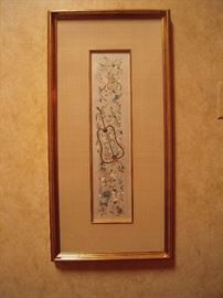 Chinese embroidered silk sleeve band framed with silk mat.  Circa first half 19th century. 