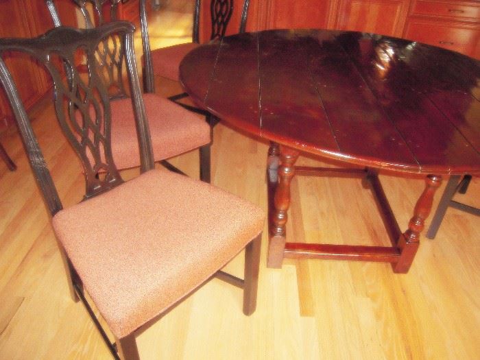 Cherry 56' dia table with 4  chairs.