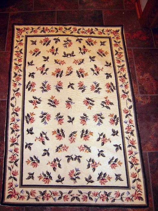 Traditional needlepoint floral rug purchased in Portugal  
