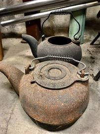 Antique cast iron pots and kettles